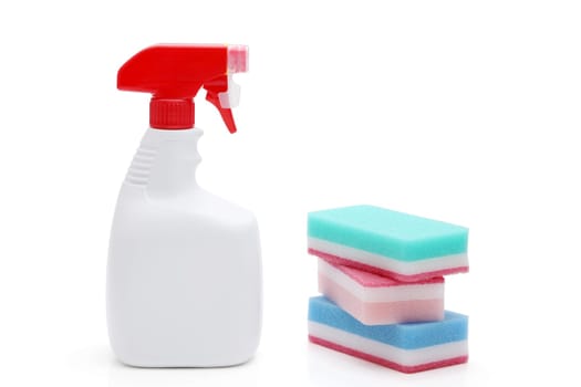 Spray plastic bottle and cleaning sponge on a white background