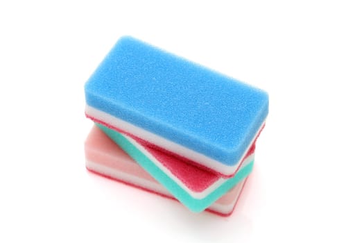 bright color rectangular sponges for washing dishes and cleaning in kitchen on white background