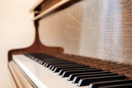 Vintage piano keyboard. Old view of piano keyboard with shallow depth of field.