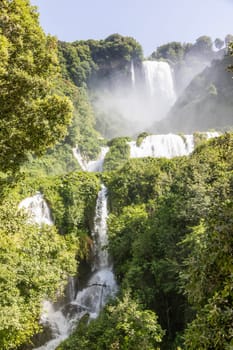 Marmore waterfall in Umbria region, Italy. Amazing cascade splashing into nature with trees and rocks.