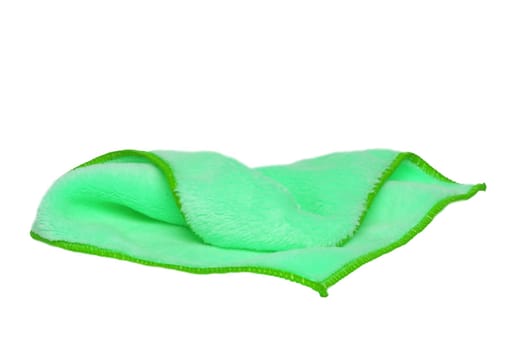Household cleanliness and hygiene. Close-up of a green cleaning cloth isolated on a white background. Microfiber cleaning cloth. Macro.