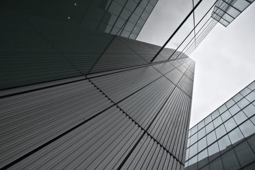 London, United Kingdom - October 22, 2006: Glass and steel offices ("More London Estates"" design by Foster and Partners) overcast sky in background. Example of modern architecture in UK capital"