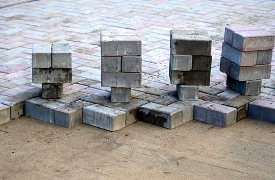 paving slabs prepared for laying on a sand cushion. High quality photo