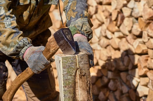 chopping firewood with an axe close-up. High quality photo