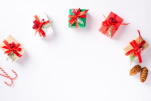 Christmas holiday composition gift boxes and decoration presents, Top view flat lay of Xmas ornament studio shot isolated on white background with copy space