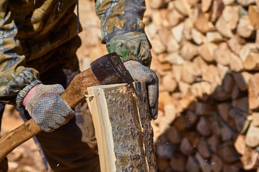 chopping firewood with an axe close-up. High quality photo