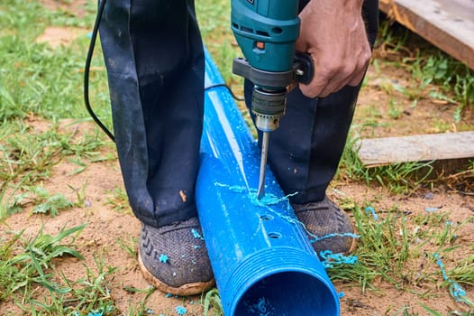 drill holes in a plastic pipe. High quality photo