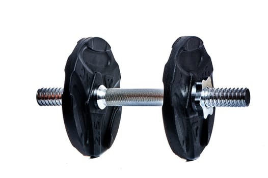 Metal dumbbell on a white insulated background. High quality photo