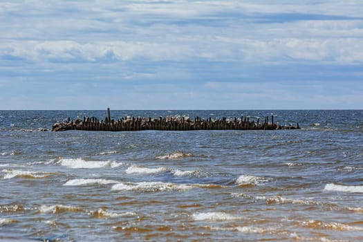 Old pier in the sea