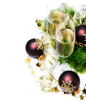 Two champagne glasses and christmas ornaments