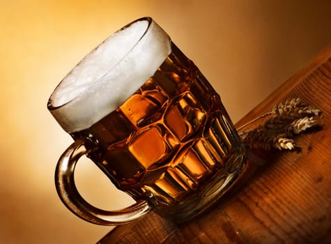 Beer mug on rustic wooden table