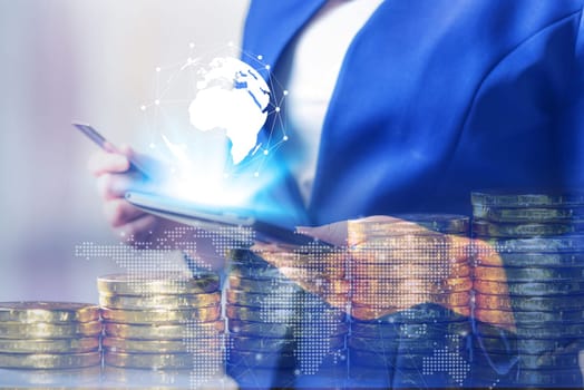 Double exposure, Technology network and online banking and internet banking and networking people concept, Business women with laptop, phone, cellphone, tablet, smartphone mobile, and credit card with coin money on business office table