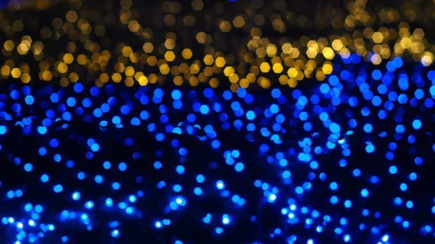 Abstract colorful bokeh light on golden background. Christmas and New Year theme