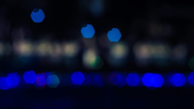 Abstract colorful bokeh light on dark background. Christmas and New Year theme
