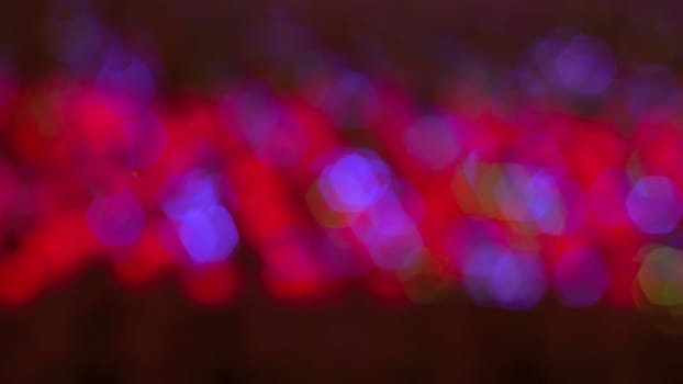 De focused abstract red and purple lights blur bokeh background abstract idea