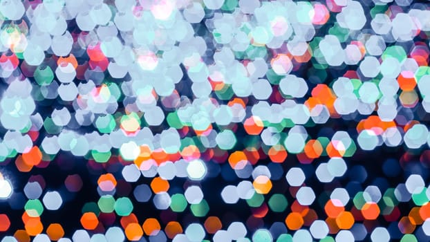 Abstract colorful bokeh light on dark background. Christmas and New Year theme