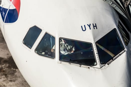 MARSEILLES, FRANCE - AUG 19, 2016: pilot prepares the flight for the next flight and works on his checklist.
