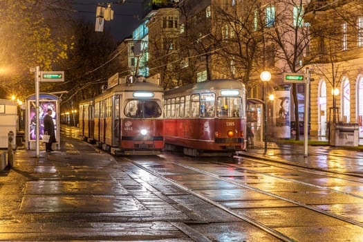 Vienna, Austria - December 9, 2009: Vienna - famous street car by night with reflection at the street in Vienna, Austria.