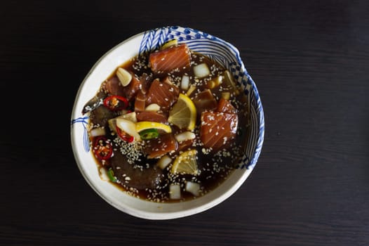 Salmon marinated shoyu or salmon pickled soy sauce in Korean style .