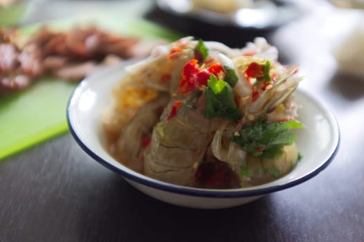 Raw mantis shrimp dressing spicy and sour fish sauce  . THAI food
