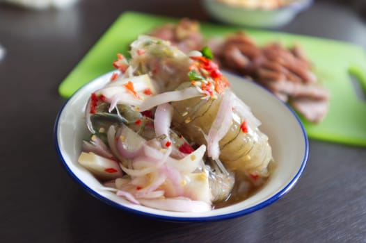Raw mantis shrimp dressing spicy and sour fish sauce  . THAI food