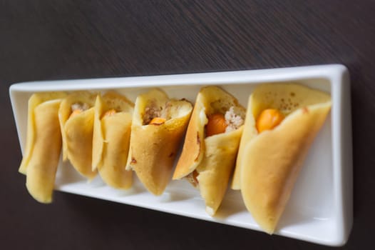 Thai dessert (Khanom Tokyo), pancake roll stuffed with minced pork  and  sausage .