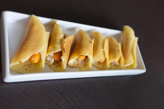 Thai dessert (Khanom Tokyo), pancake roll stuffed with minced pork  and  sausage .