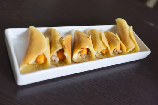 Thai dessert (Khanom Tokyo), pancake roll stuffed with minced pork  and  sausage .