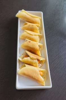 Thai dessert (Khanom Tokyo), pancake roll stuffed with minced pork  and  sausage .
