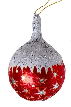 Christmas tree decorations. Close-up of cheerful wrapped chocolate xmas balls and cones figurines isolated on a white background. Macro photograph.