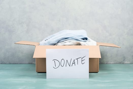 Package with used clothes for donation, second hand use for poor people, welfare