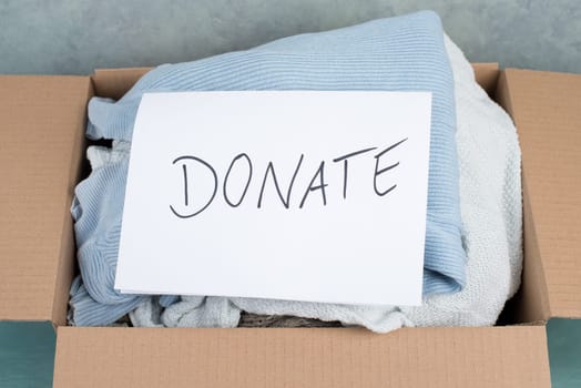 Package with used clothes for donation, second hand use for poor people, welfare
