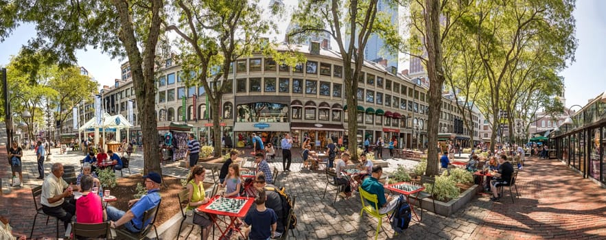 BOSTON, USA - SEP 12, 2017:  people visit Quincy Market area and sit outside to enjoy the summer day  at the freedom trail.