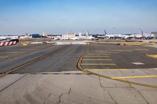 NEW YORK, USA  OCT 4, 2017: aircrafts at runway and apron of JFK Airport in New York. JFK airport is the biggest in New York and houses most international airlines.