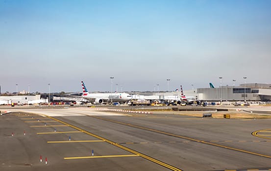 NEW YORK, USA  OCT 4, 2017: aircrafts at runway and apron of JFK Airport in New York. JFK airport is the biggest in New York and houses most international airlines.