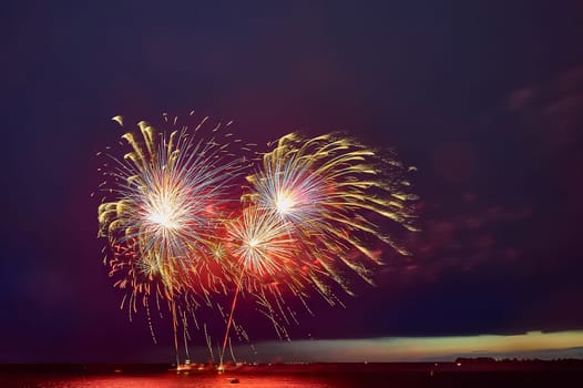 Colorful fireworks on the black sky background. High quality photo