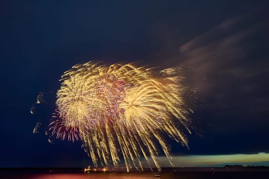 Colorful fireworks on the black sky background. High quality photo