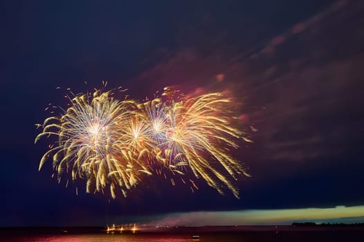 Colorful fireworks on the black sky background. High quality photo