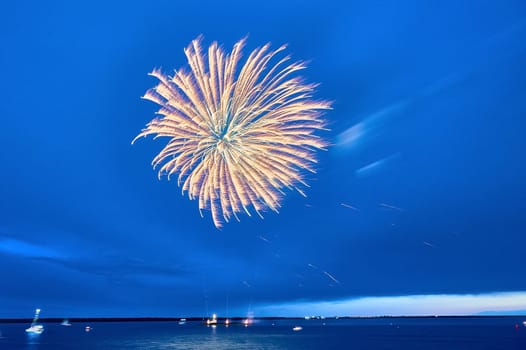 Colorful fireworks on the black sky background. High quality photo