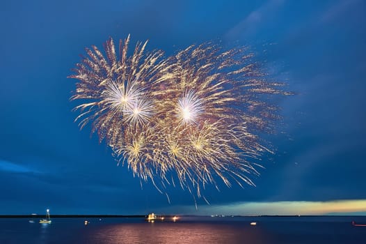 Colorful fireworks on the black sky background. High quality photo