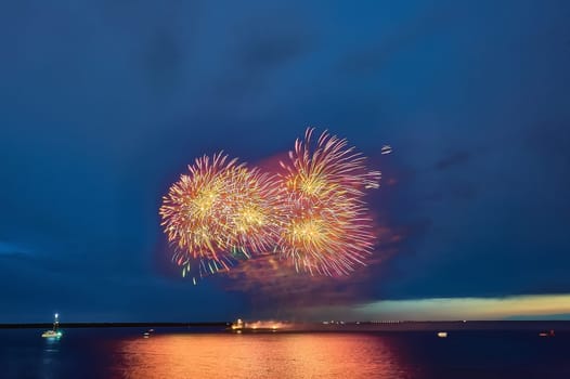 Colorful fireworks on the black sky background. High quality photo