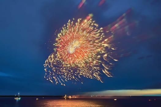 Colorful fireworks on the black sky background. High quality photo