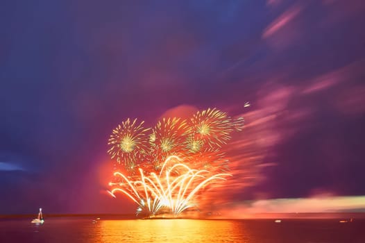 Colorful fireworks on the black sky background. High quality photo