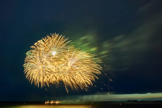 Colorful fireworks on the black sky background. High quality photo
