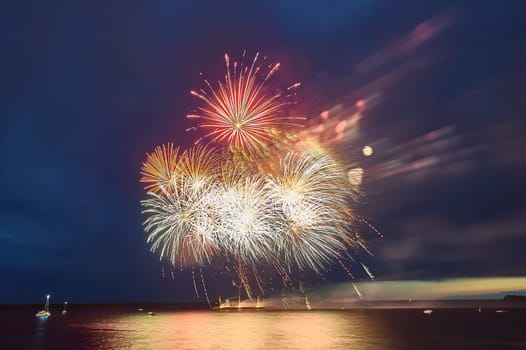Colorful fireworks on the black sky background. High quality photo