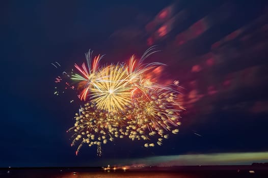 Colorful fireworks on the black sky background. High quality photo