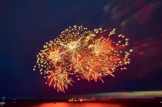 Colorful fireworks on the black sky background. High quality photo