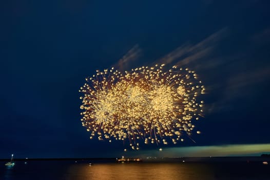 Colorful fireworks on the black sky background. High quality photo