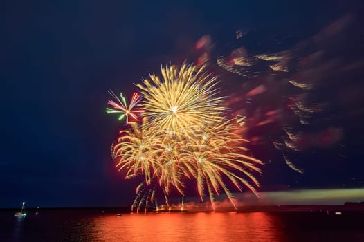 Colorful fireworks on the black sky background. High quality photo