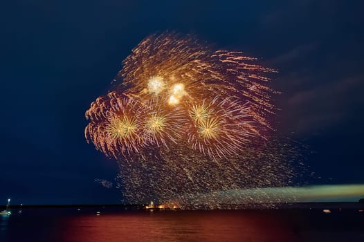 Colorful fireworks on the black sky background. High quality photo